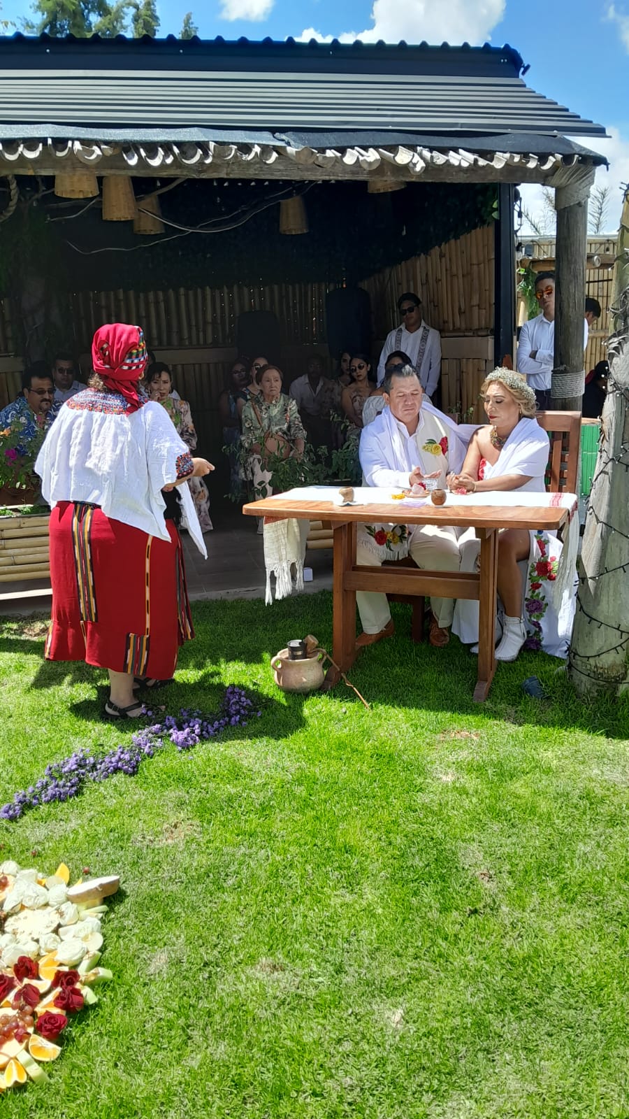 Couple celebrating a spiritual wedding with ceremonial guides in San Cristóbal de las Casas.