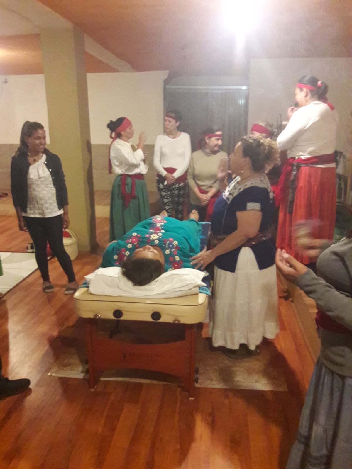 Therapist performing a traditional Mayan massage with natural oils.